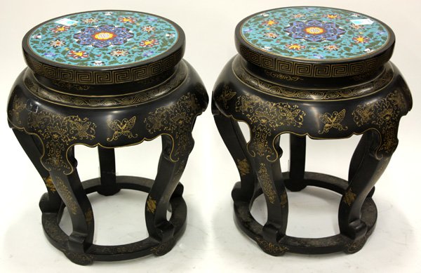 Pair Chinese Ebonized Wood Stools/Cloisonne Plaque: Pair of Chinese gilt decorated ebonized wood stools, each circular top inset with a cloisonne enamel plaque of various leafy floral tendrils amid a turquoise ground, set over a waist then gradually fl