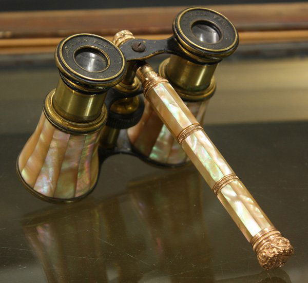 Victorian mother of pearl opera glasses: Victorian mother of pearl opera glasses having central handle and bass mounts, marked ''Lamaire Paris,'' 5''h x 4''w