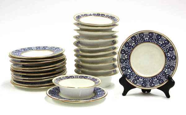 Minton ramekins: (lot of 23) Set of eleven Minton ramekins and underplates having blue and white Indian influenced pattern with gilt trim, retailed by Davis Collamore & Co. New York, includes one spare underplate, 1.5