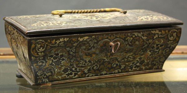 Boulle and ivory inlaid box: Boulle and ivory inlaid box, the casket form box having a brass handle with the cartouche of a bird on a tree, the whole with intricate detail, possibly Persian 3''h x 9''w x 4''d (losses)