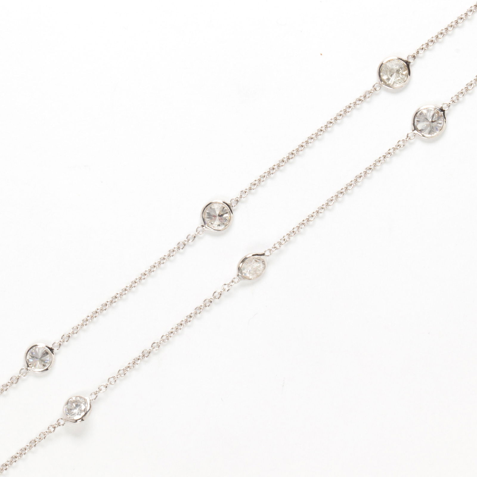 A diamond and fourteen karat white gold necklace (1 of 2)