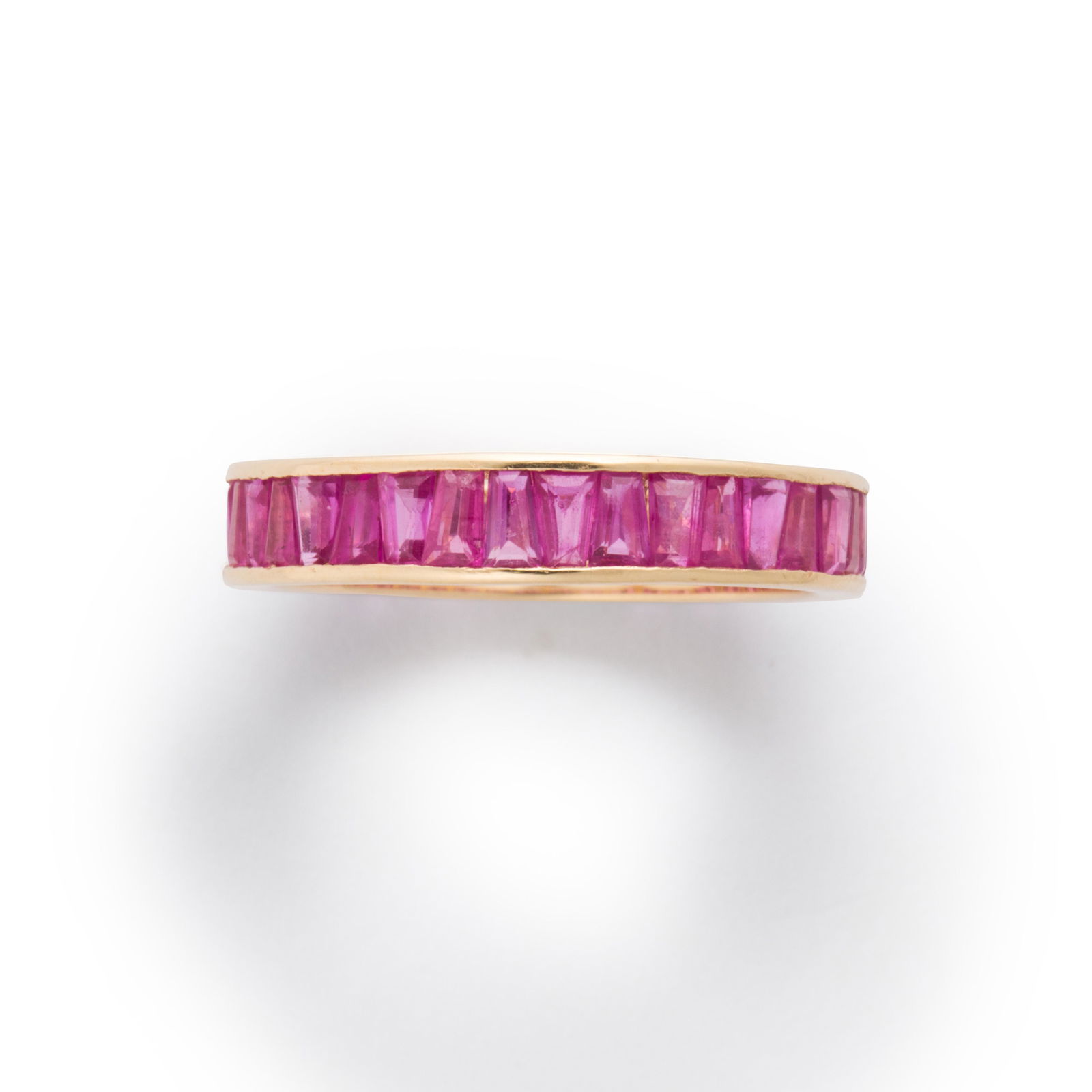 A ruby and fourteen karat gold ring (1 of 2)