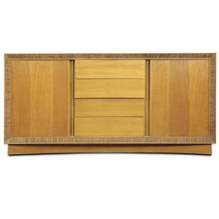 A Paul Frankl for Brown Saltman: A Paul Frankl for Brown Saltman, California, limed mahogany chest, having a rectangular top, above the case with four drawers and two doors, and rising on a concave base, 32"h x 66"w x 19"d