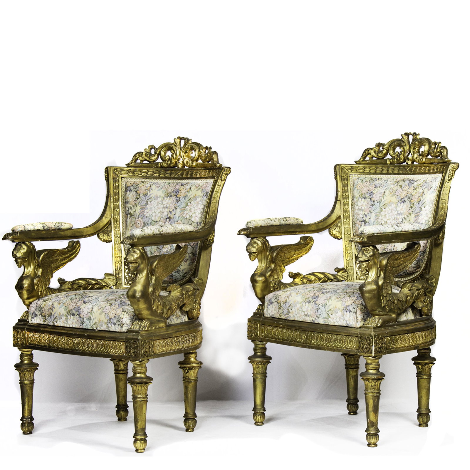 (lot of 2) Louis XVI style giltwood fauteuils: (lot of 2) Louis XVI style giltwood fauteuils, each having a scroll and acanthus carved crest, above floral upholstery, continuing to Sphinx form arm supports, and rising on tapered and turned legs, 3