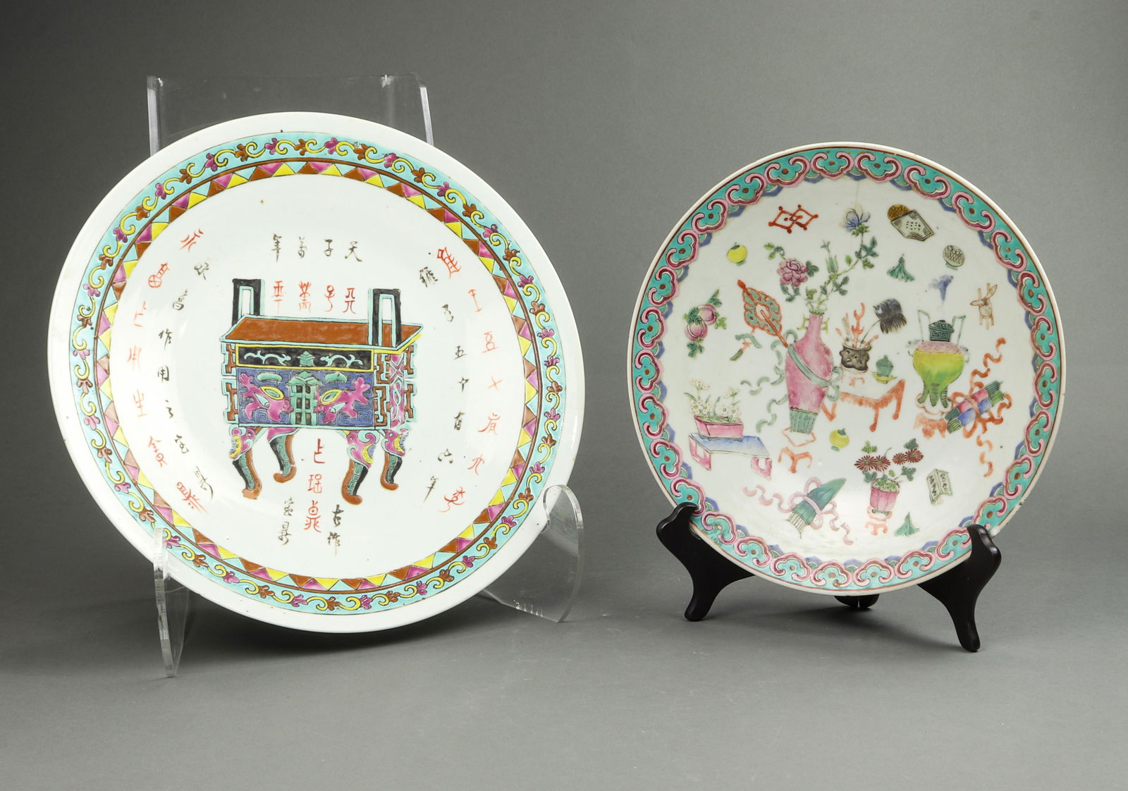 (lot of 2) Chinese famille rose dishes: (lot of 2) Chinese famille rose dishes, the first is decorated with a square ding vessel with various inscriptions; the second is decorated with various antiques and auspicious objects, 14.5" and 11.7
