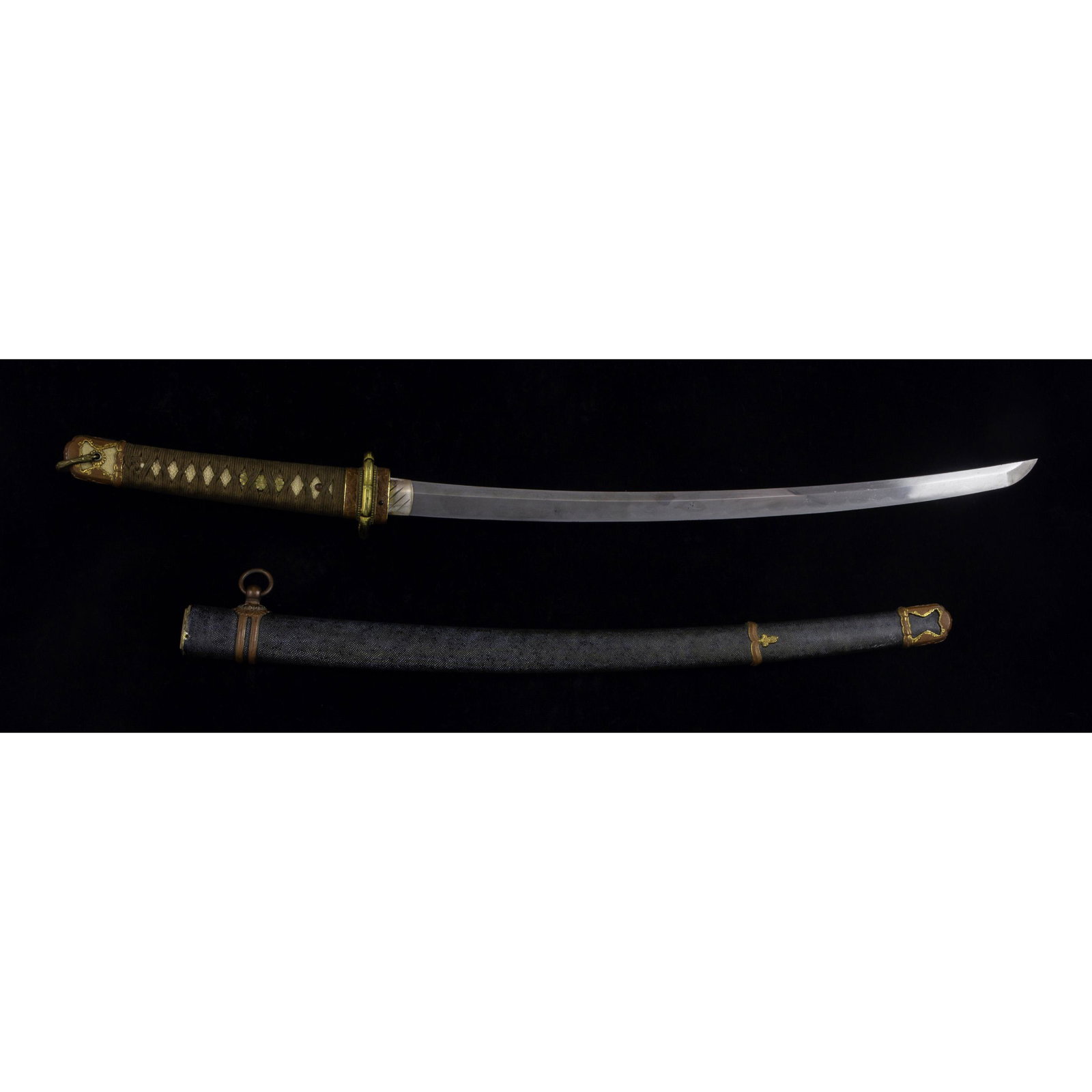 A Japanese samurai/katana sword: A Japanese samurai/katana sword, the brown silk cord wrapped shagreen tsuke, fitted with floral menuki, twin copper fuchi and gilt brass reticulated tsuba decorated with floral mon, the habaki collare