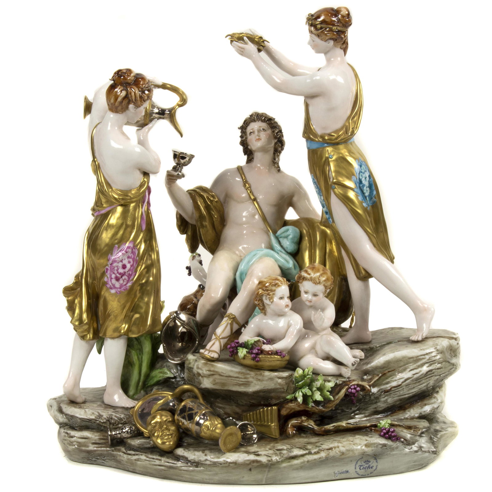 A large Capodimonte bacchanalian porcelain group: A large Capodimonte bacchanalian porcelain group, depicting two beauties serving Bacchus wine, with two putti seated on a naturalistic base with empty wine carafes, on verso a putti serving a beast gr