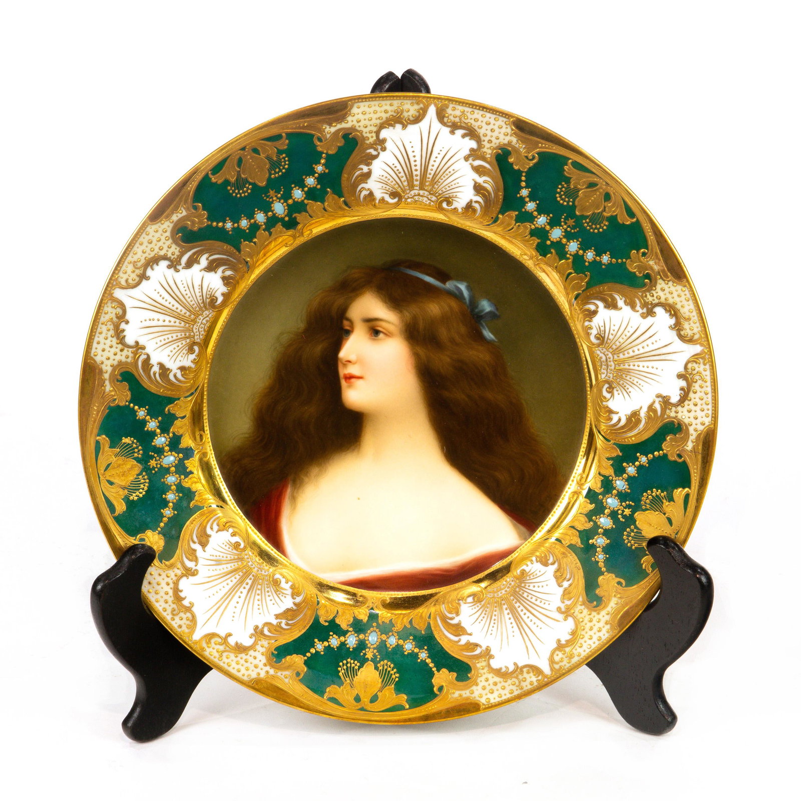 A Royal Vienna style porcelain portrait cabinet plate: A Royal Vienna style porcelain portrait cabinet plate, faintly signed Wagner to the lower right, the border with a gilt foliate scroll and jeweled beaded accents, framing the centered light haired bea