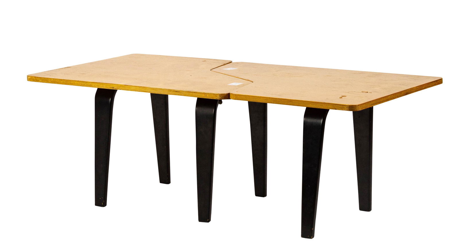 (lot of 2) Cees Braakman tables: (lot of 2) Cees Braakman tables, each having a puzzle piece top, above ebonized legs, overall: 17"h x 47.5"w x 23.5"d