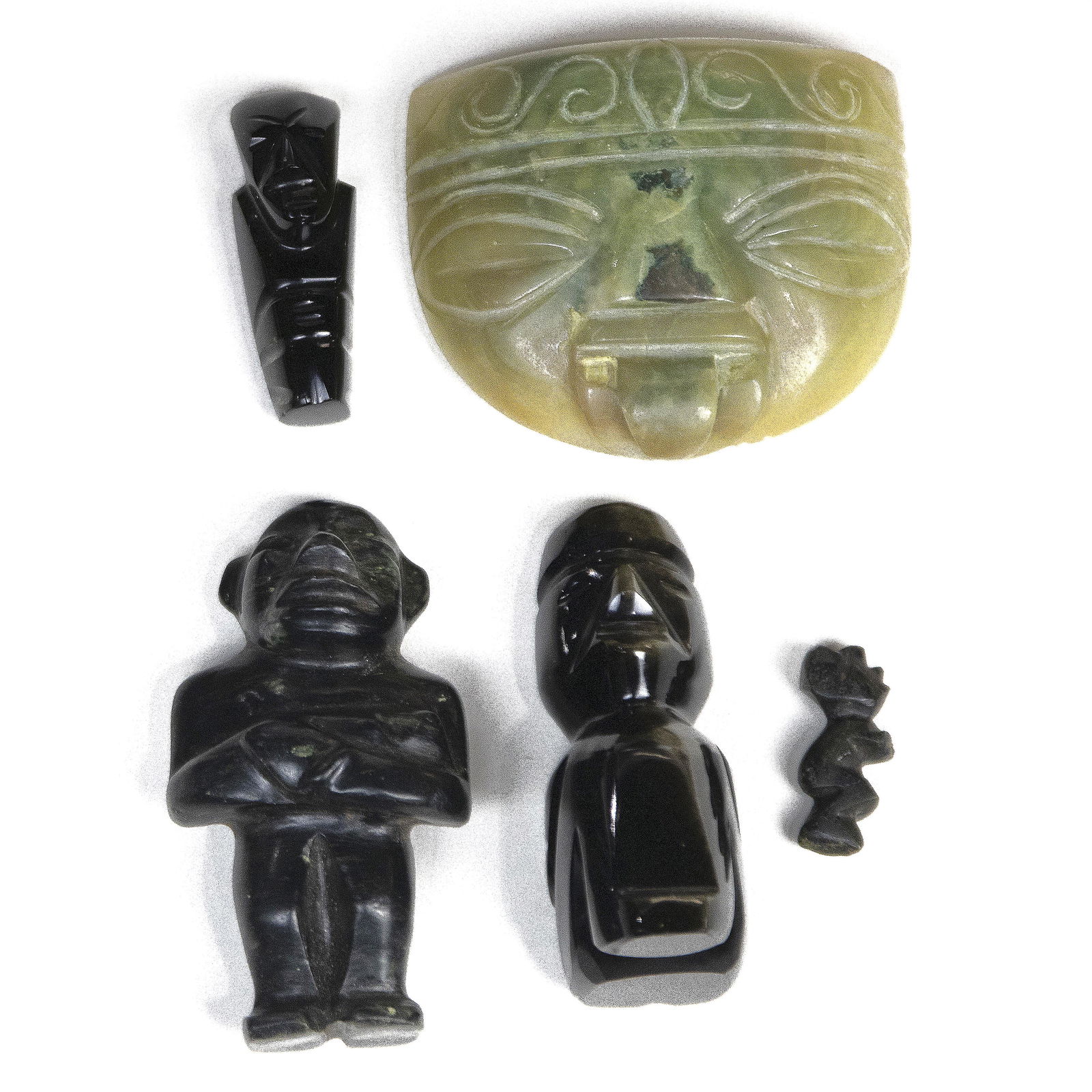 (lot of 5) Mexican stone carvings: an Olmec mask and: (lot of 5) Mexican stone carvings: an Olmec mask and (4) figures, the largest 2.75"h x 2.25"w