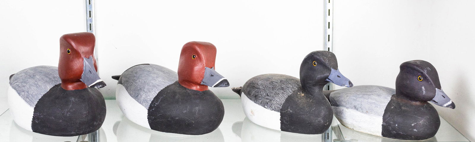 (lot of 4) Painted duck decoys, each with carved: (lot of 4) Painted duck decoys, each with carved signature "CM", possibly Charles Moore: a pair Redhead Drakes and a pair Maynards the largest 15"l, Provenance: Menlo Park Estate