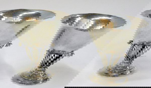 Pair of Jensen sterling compotes: Pair of Georg Jensen sterling compotes each on circular base with openwork support holding a flared bowl, designed by Johan Rohde, post 1945 mark, 21.6 total ounces, approx. 5''h