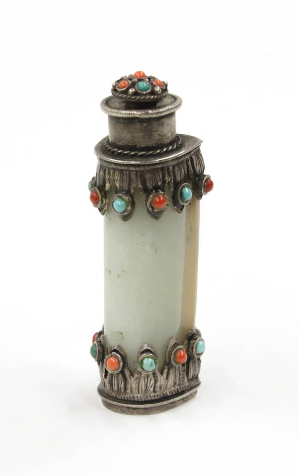 Chinese Mongolian Style Jade/Silver Snuff Bottle,: Chinese Mongolian style nephrite jade snuff bottle, Qing Dynasty, with a slender semi-circular pale green body bracketed by silver metal mounts with leaf-like pendants scattered with turquoise and cor