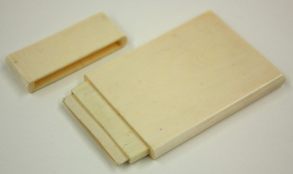 Chinese Ivory Card Case: Chinese ivory card case, 19th century, the plain rectangular body with rounded edges and pronounced grain, with two antique calling cards, 3.5''l; Provenance: Estate of Dr. Sidney Widrow, Hawaii