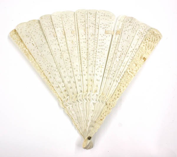 Carved Chinese Ivory/Bone Folding Fan: Chinese export folding fan, late 19th/early 20th century, the ivory guards carved with figures in a landscape and reversed by an incised floral pattern, all bracketeing finely pierced bone ribs with s