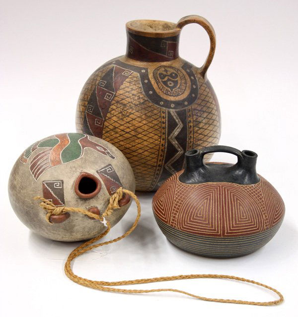 Native American pottery: (lot of 3) A hand constructed polychrome decorated pottery pitcher from Chile signed Huaquilen '86, a polychrome decorated pottery eagle canteen from Chile signed Huaquilen '87, and a signed contempor