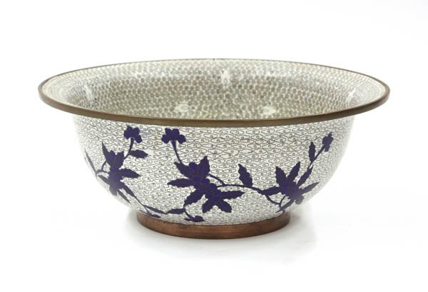 Chinese Cloisonne Enamel Bowl: Chinese cloisonne enamel decorated bowl, of inverted bell form with stylized floral motif amid a dense spiraled white ground to the interior, the exterior with blue leafy sprigs on a cloud scroll grou