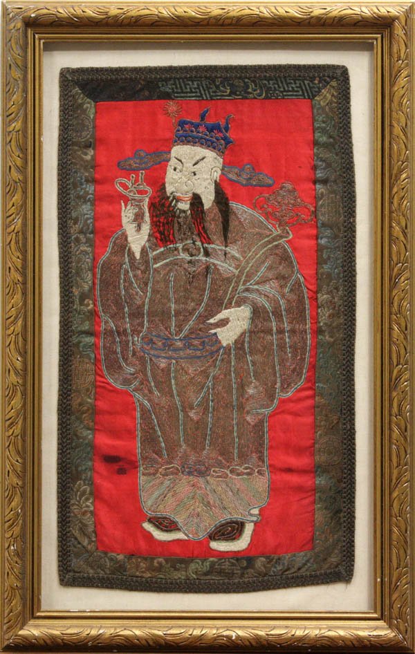 Embroidered Chinese Textile, Lu Immortal: Framed Chinese embroidered panel, featuring Lu (one of the Three Star Immortals) standing in metallic couched robe holding a libation cup and ruyi scepter amid a pink satin silk ground (losses and sta