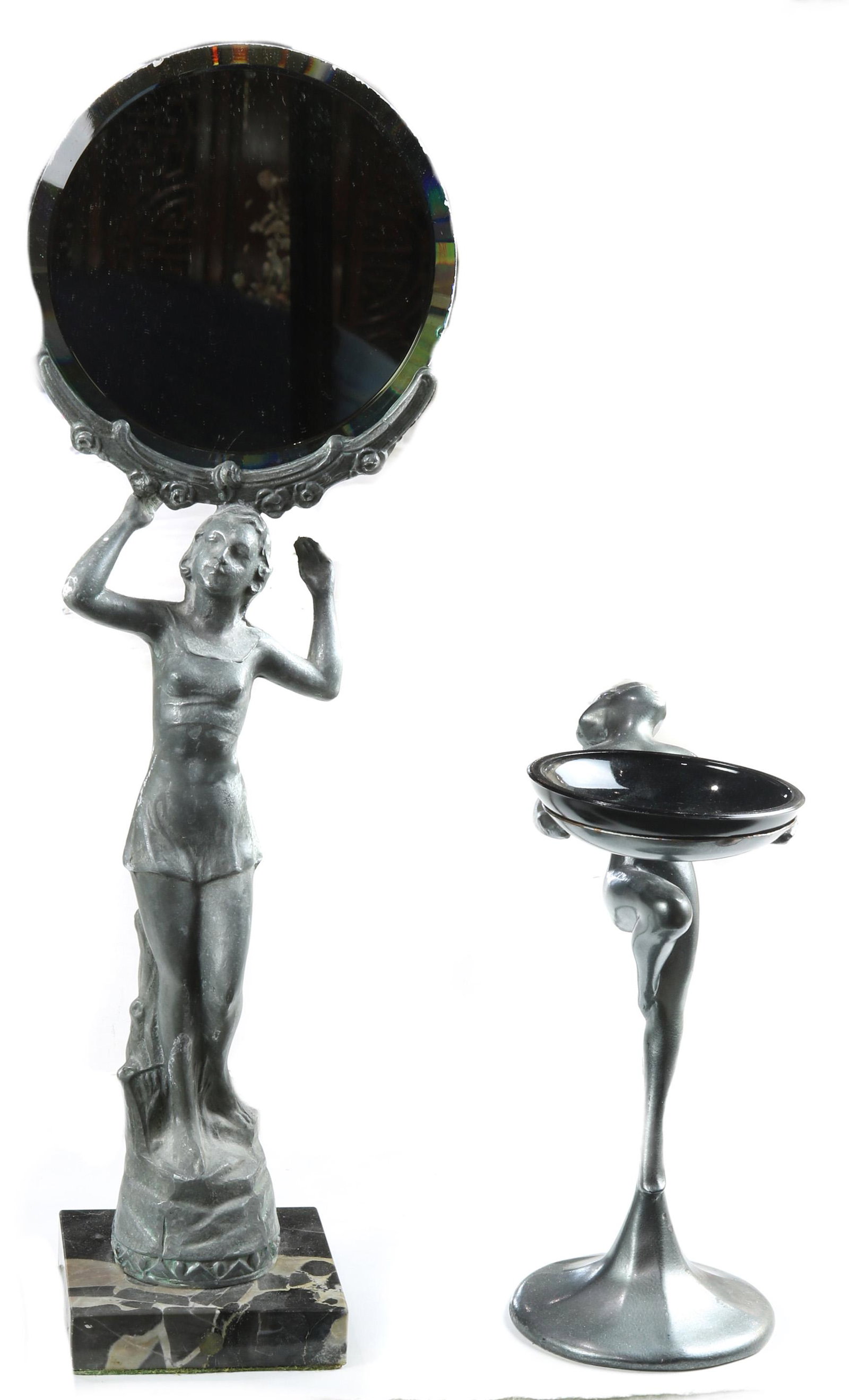 (Lot of 2) Art Deco style nude mirror and pin tray with: (Lot of 2) Art Deco style nude figural white metal mirror on a marble base together with an associated nude figural pin tray fitted with a black glass tray, the taller 16"h