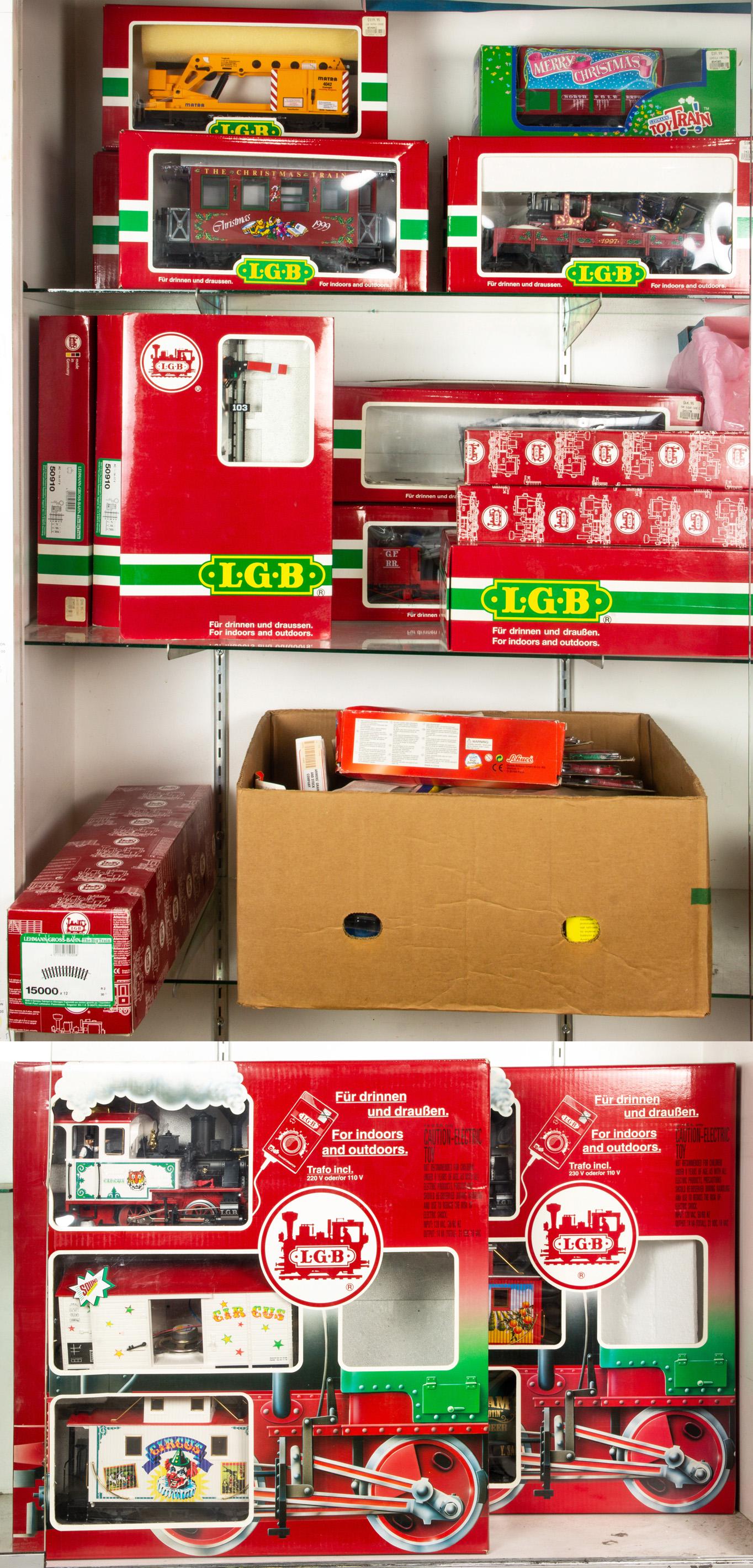 Four shelves of boxed model trains and equipment (1 of 4)