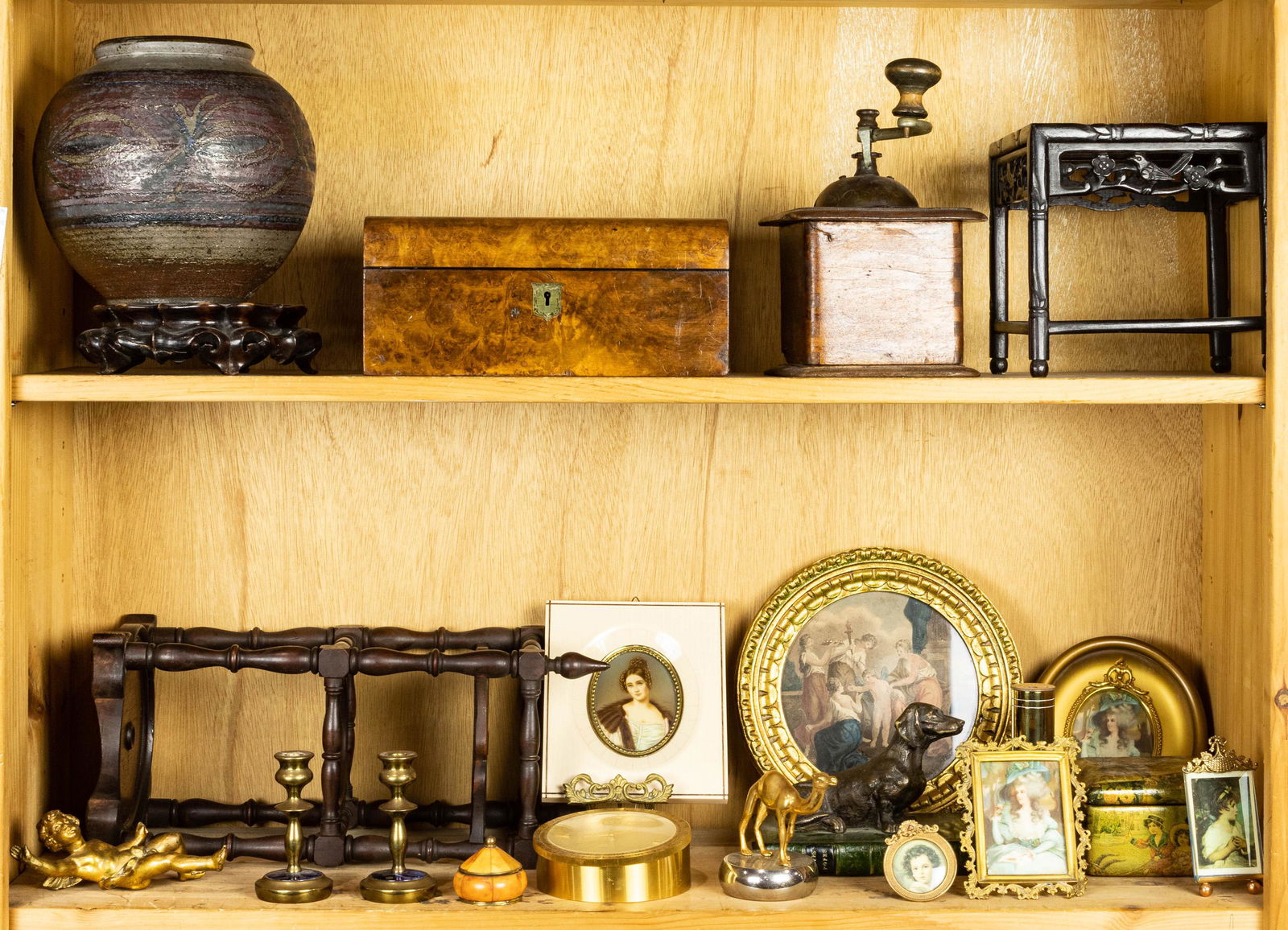 (lot of 20) Assorted decorative objects: (lot of 20) Assorted decorative objects, including a domed top tea caddy, a Chinese style stand, various gilt frames, a pair of diminutive brass candle sticks, a three tier stand, 15"h, etc.