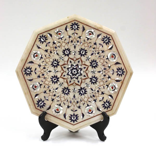 Agra inlaid marble table top: Agra inlaid marble table top, the lapis and mother of pearl having a flower decorated medallion with radiating symmetrical flowers terminating in buds and leaves, 16''w