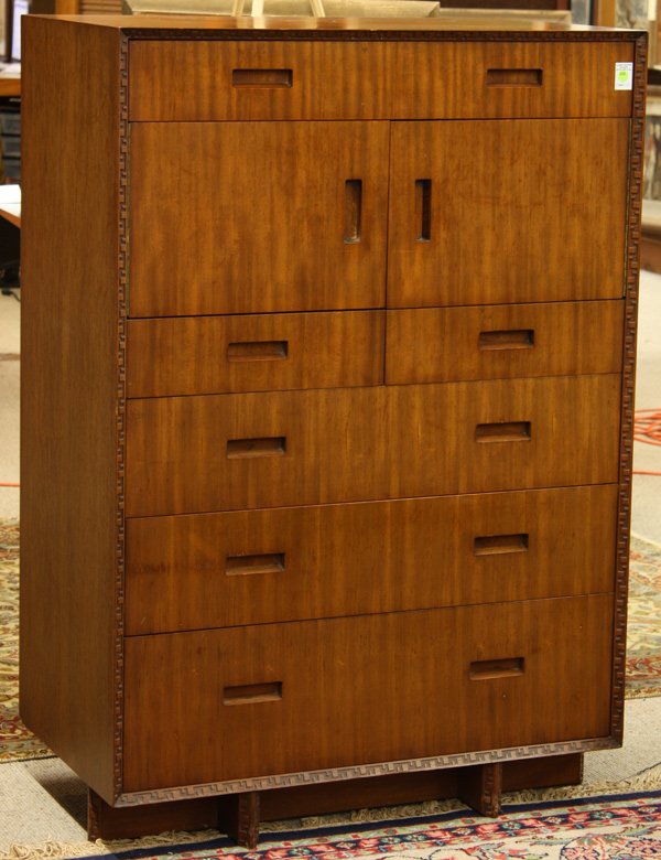 Frank Lloyd Wright/Henredon Taliesin highboy: Frank Lloyd Wright for Heritage Henredon gentlemans chest circa 1950, the rectangular top above the case having the famous Taliesin patterned edges, raised on a shoe base with a conjoined stretcher, s