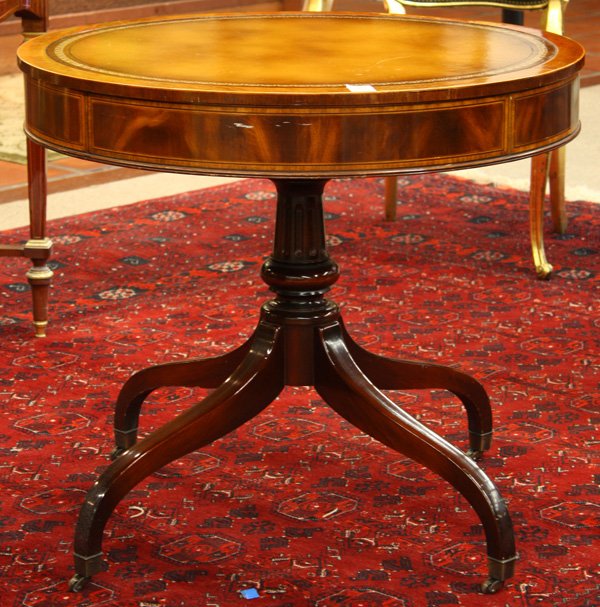 Classical style inlaid drum table: Classical style mahogany inlaid drum table, circa 1940, the embossed leather top above the band inlaid apron having a single drawer, the compressed ball standard rising on four spade legs terminating 