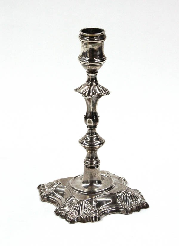 English sterling candle holder: English sterling candle holder 1777/1778, having a ring and compressed shaft supporting the tapered holder, and raised on a scalloped base, 15 troy oz.