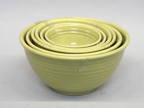 Bauer of California graduated bowls: (lot of 6) Bauer of California graduated ringware bowls executed in chartreuse, largest 5.5''h x 11''w
