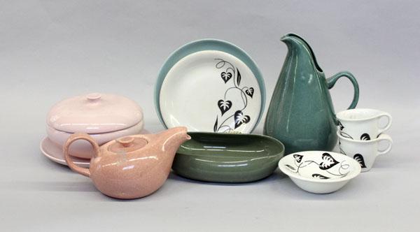 Russel Wright pottery: (lot of 75) Two shelves displaying Russel Wright pottery table services and articles consisting of Sterling ''Ivy'' pattern, Steubenville, and Iroquois