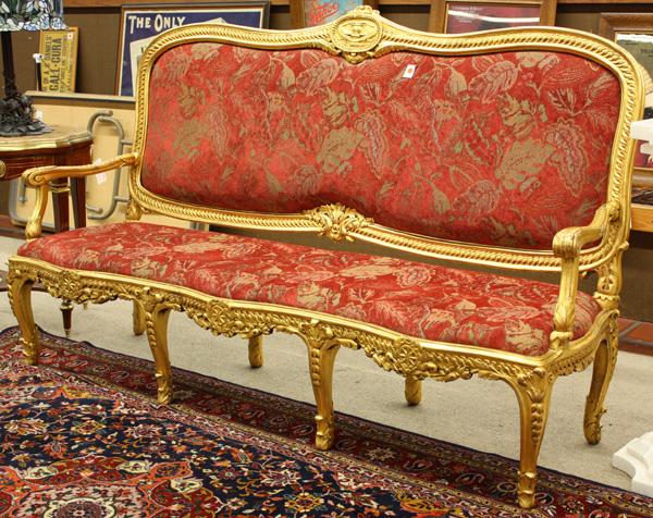 Louis XVI Style Settee: Louis XVI style gilt settee, having a shaped crestrail with a medallion having an urn and crane motif, the arms with acanthus detail at the returns, raised on cabriole legs with bellflower reserves, 4