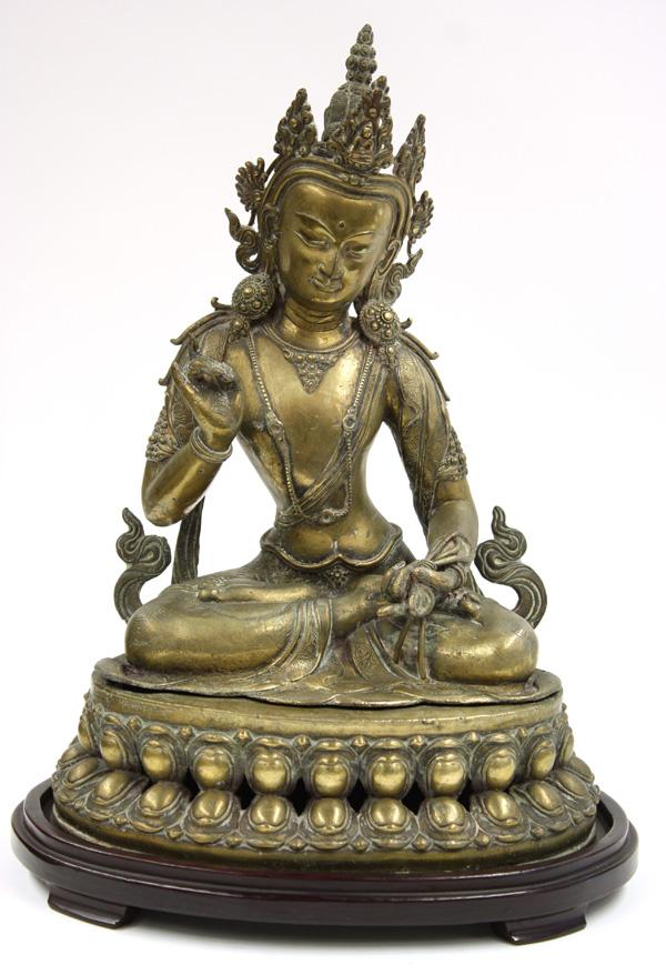 Himalayan Copper Alloy Large Buddhist Figure: Himalayan large copper-alloy figure of a bodhisattva, 20th century, cast in two sections, the princely figure seated in a pose of meditation with his right hand raised, the other holding a noose, the 