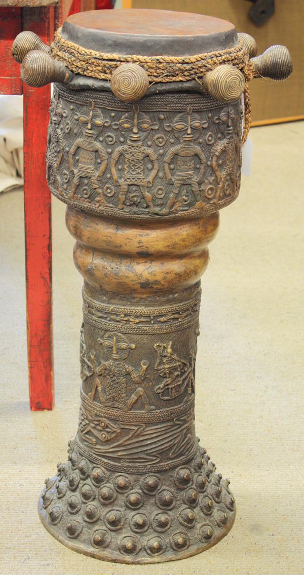 West African drum: West African drum, metal with leather skin, showing figures in relief