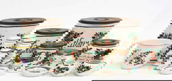 Bauer Pottery Canister Set: (lot of 16) Bauer Pottery canister set, each having polychrome fruit decoration, including a sugar, flour, coffee, tea, garlic, and jam containers with lids, with salts and pepper, cream and sugar, an