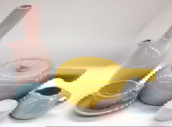 Russel Wright pottery Iroquois: Two shelves with a collection of Russel Wright China by Iroquois in pastel pink and blue including platters, plates, vases, cups, saucers, sugars, creamers, etc., 78 pieces total