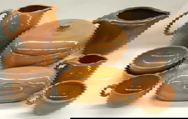 Russel Wright Iroquois tableware: Two shelves with a collection of Russell Wright Iroquois tableware in mostly fudge and cinnamon, including plates bowls, cups, saucers, platters, bowls, pitchers, covered casseroles, gravies, etc., 10