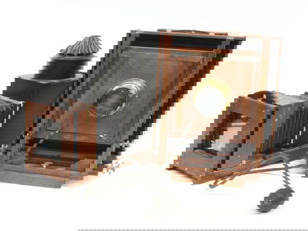 View camera and magic lantern,: View camera and magic lantern, Gundlach 12'' x 12'' mahogany camera, 5'' x 7'' ground glass mounted to back, 12'' Homocentric 1:5.6, Ross, London brass lens, composite bellows, 15'' x 12'' x 34'', mag