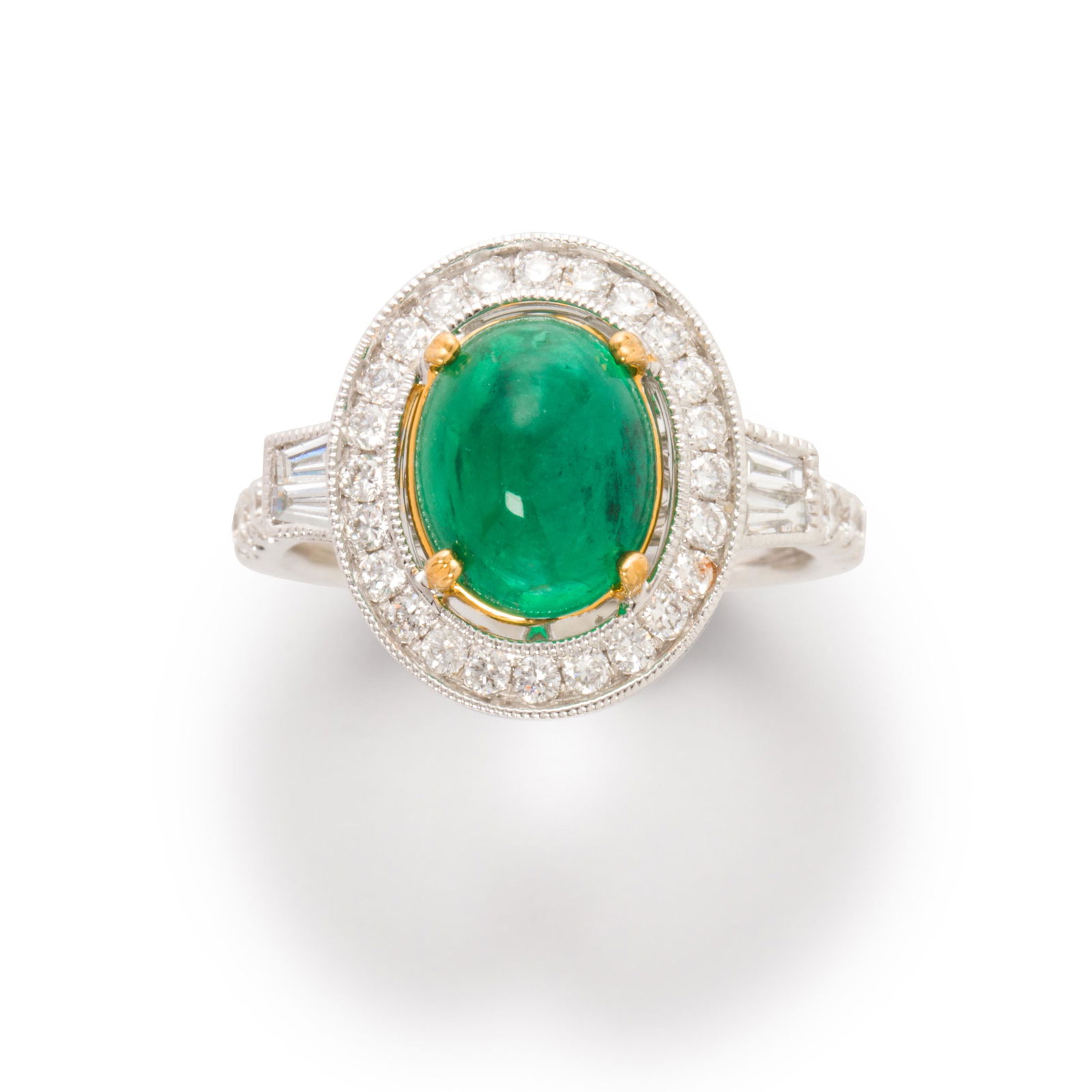 An emerald, diamond and fourteen karat white gold ring (1 of 2)