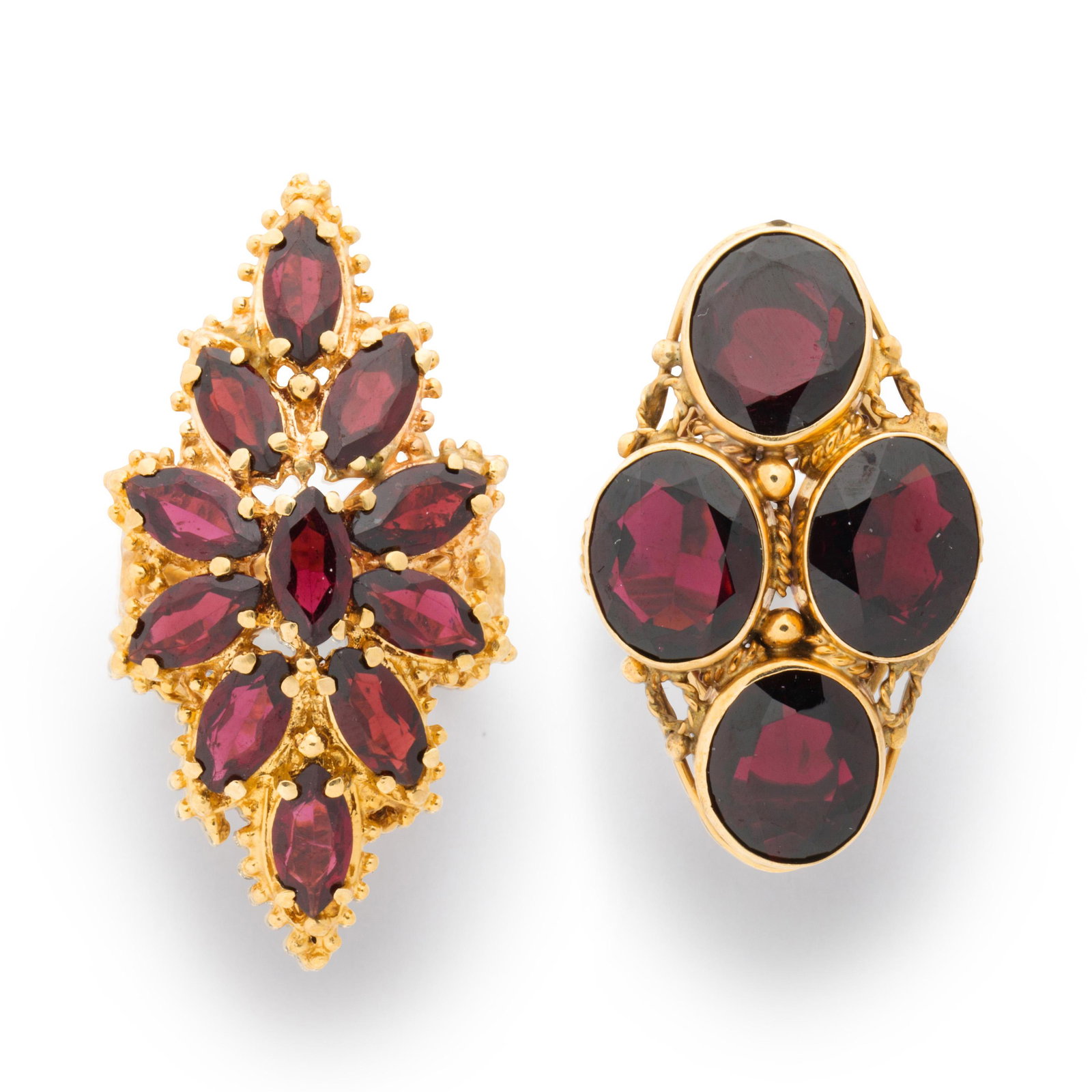 A group of garnet and fourteen karat gold rings (1 of 3)