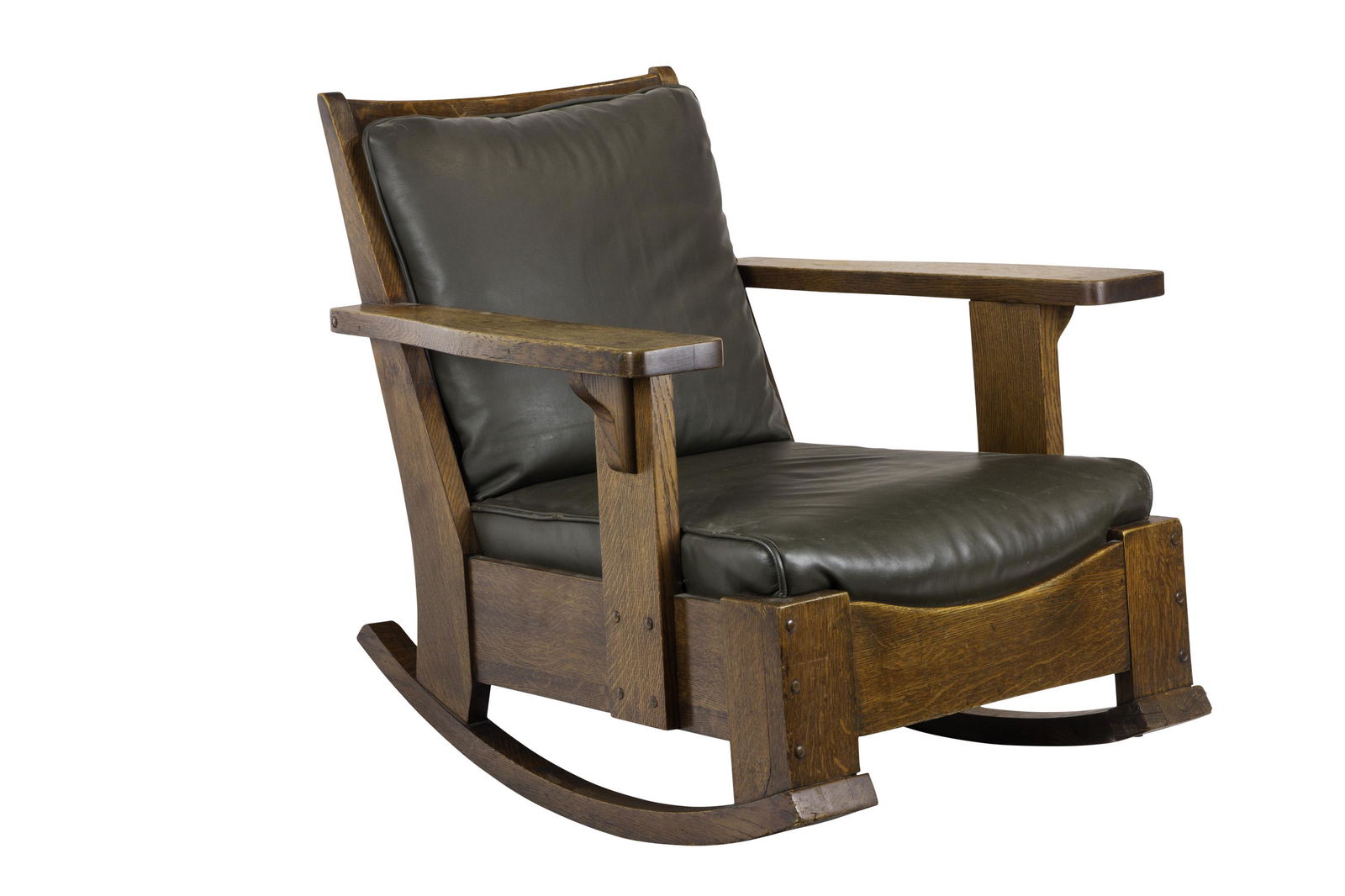 Limbert rocker #819: Limbert rocker #819, the massive form with a curved front rail, corbel supports to sides and raised peg detail, nicely recovered leather cushions, original finish, branded signature, 33"w x 36"d x 32"