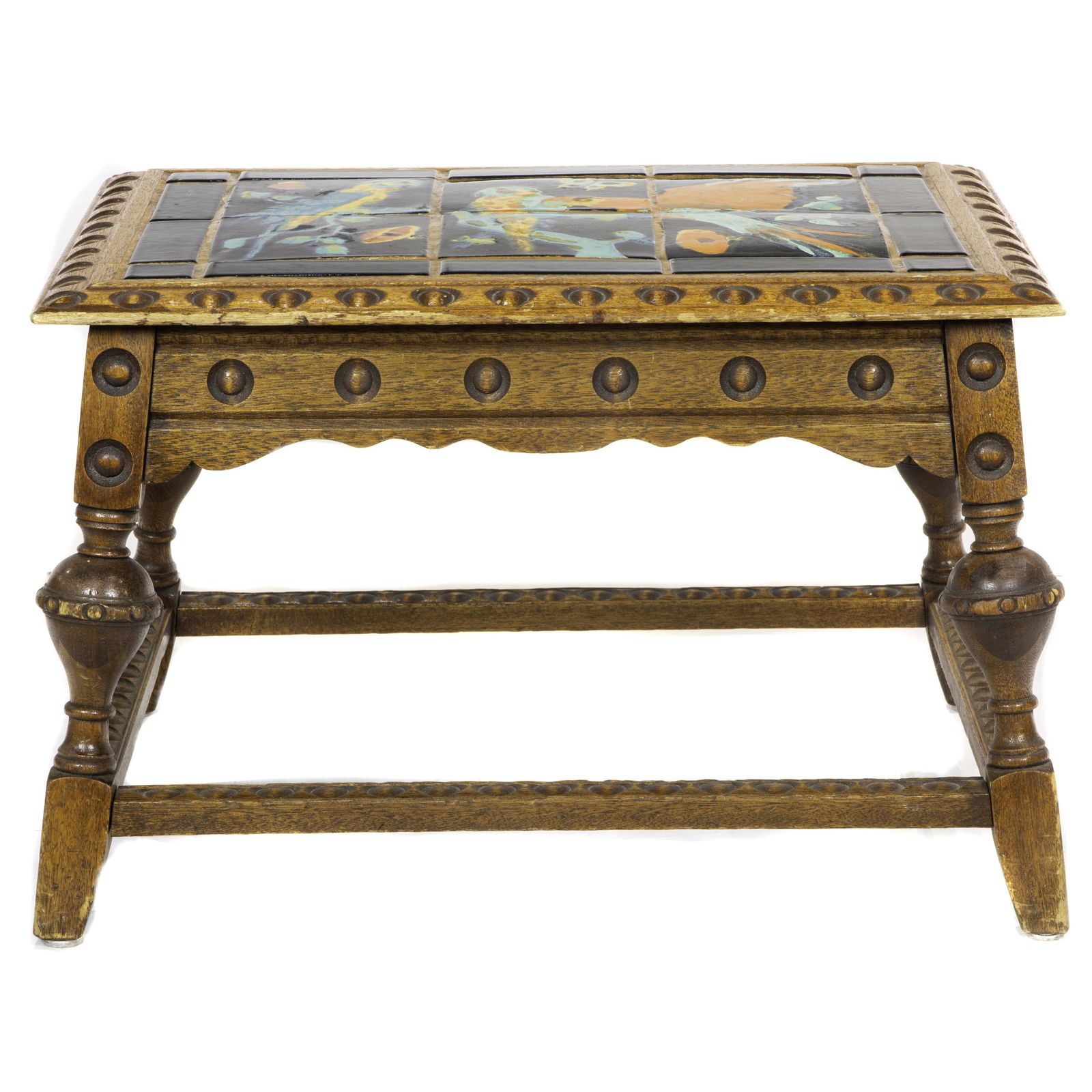 An Arts and Crafts Taylor of California tile top table: An Arts and Crafts Taylor of California tile top table, the tiles inset in a carved oak frame rising on turned legs, 16.5"h x 26"w x 19.5"d