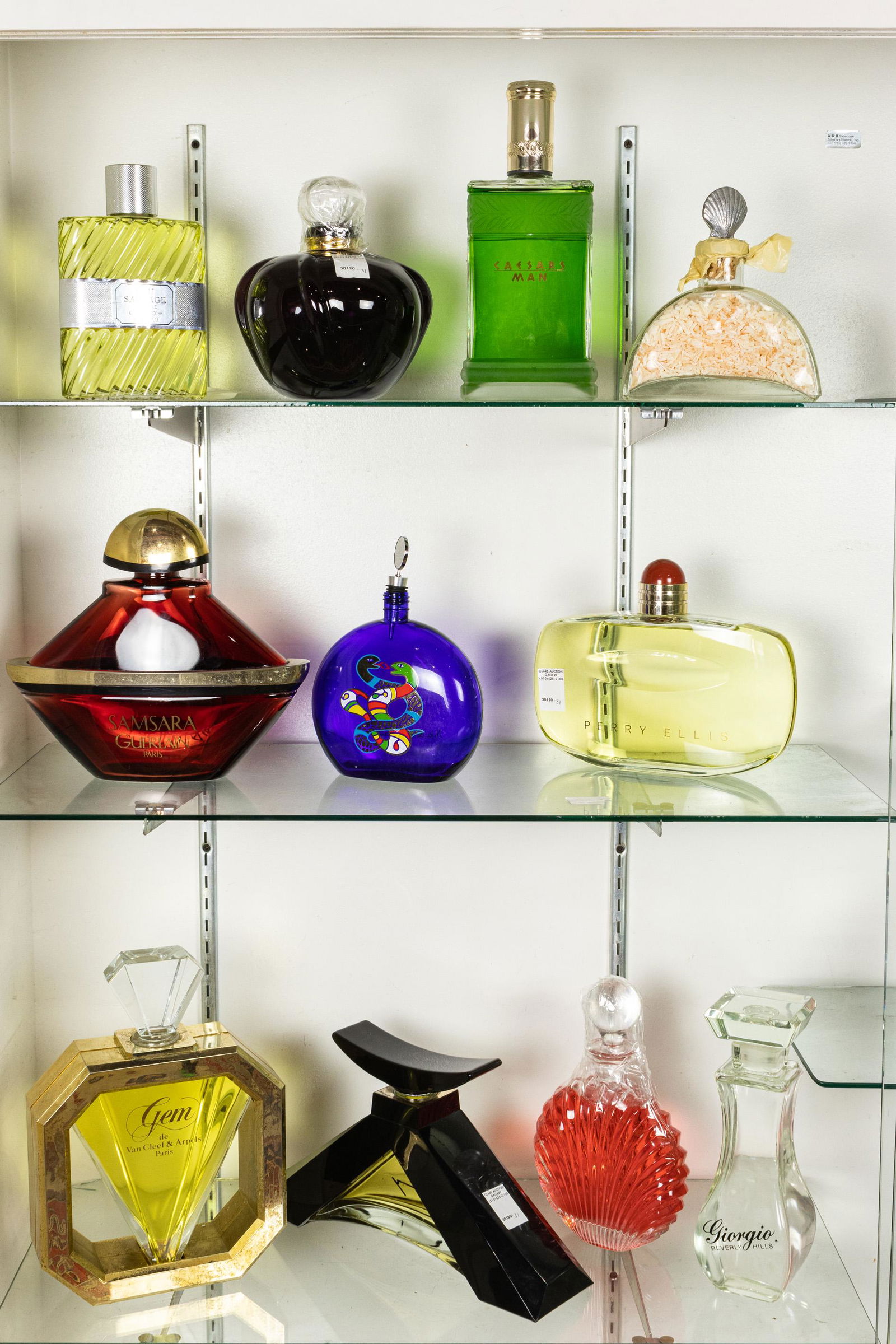 (lot of 11) Perfume advertising group: (lot of 11) Perfume advertising group, consisting of Van Cleef and Arpels, Christian Dior, Perry Ellis, Samsara Guerlain, etc., largest 13.5"h