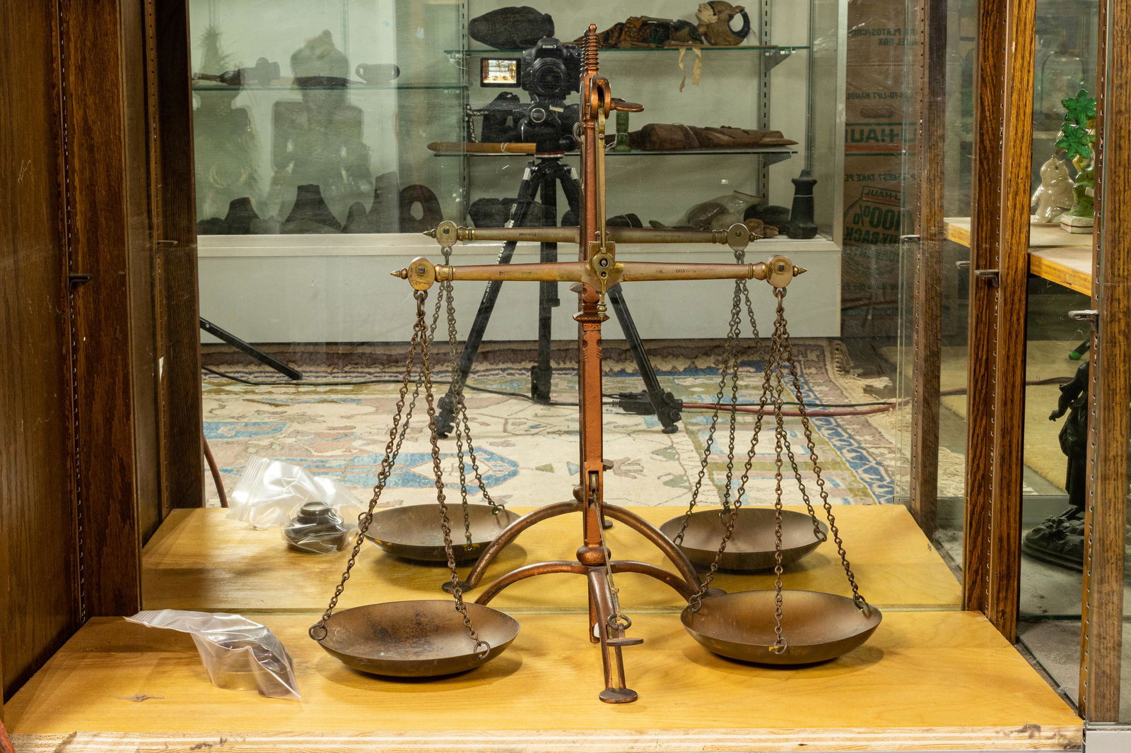 Antique balance beam scale: Antique balance beam scale, together with five weights, 22"h x 17"w