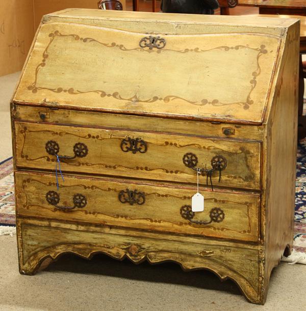 Continental polychrome decorated fall front desk: 18th century Continental polychrome decorated fall front desk, the hinged drop front with its original escutcheon and having evidence of a pinwheel medallion opening to reveal a fitted and painted int