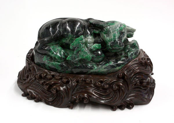 Chinese Large Jadeite Carved Ox: Chinese large jadeite carving of a recumbent ox, its head turned towards a spray of lingzhi clustered near the right front leg tucked beneath the massive body, portions of the design picked out from t