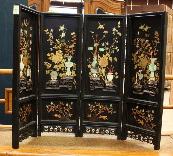 Chinese Inlaid Four Panel Table Screen: Chinese black lacquer four panel table screen with inlay, featuring vases of flowers and scholar's items supported on a tiered stand, all executed from jade, jadeite, hardstone, soapstone, coral, ivor