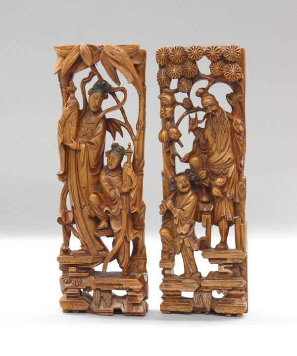 Pair of Chinese Wood Carvings: (lot of 2) Chinese wood carvings, of rectangular form carved and undercut with a female immortal and attendant each holding an amphora framed by bamboo leaves (repairs); the second featuring a male im