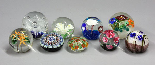 Art Glass Paperweights: (lot of 9) Group of art glass paperweights of various styles including mille fleur and cased flowers, three by Orient & Flume