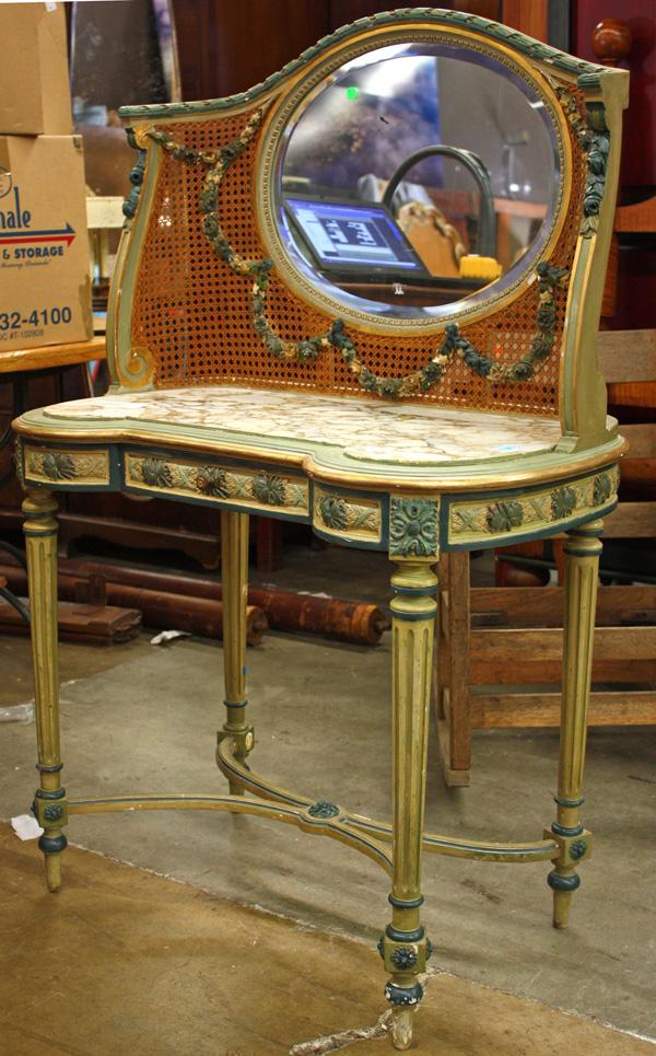 Louis XVI style vanity and etagere: (Lot of 2) Louis XVI style vanity, having an oval mirror within a caned back with applied floral elements above the inset marble top, raised on fluted legs, 52"h x 35"w, together with a Louis XVI styl